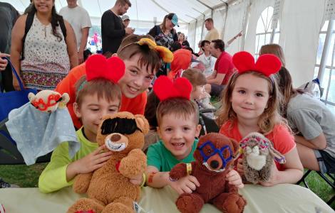 Children with Stuffies at MAO Tent